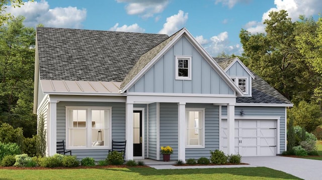 view of front of house featuring a garage and a front yard