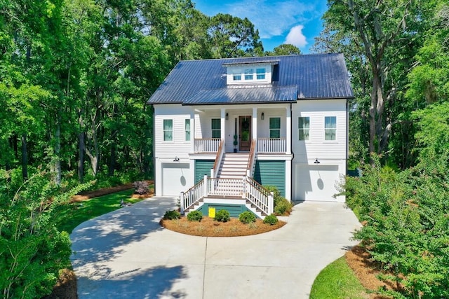 view of front of house with a porch and a garage