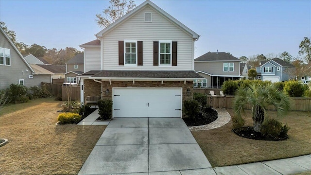 view of front of home with a garage and a front lawn