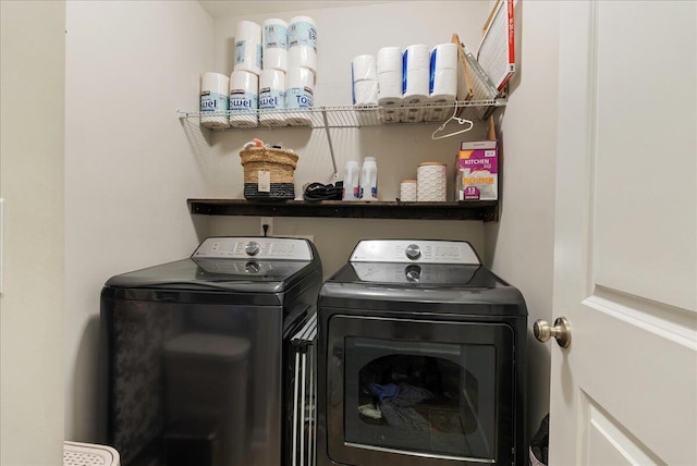 washroom featuring washing machine and dryer