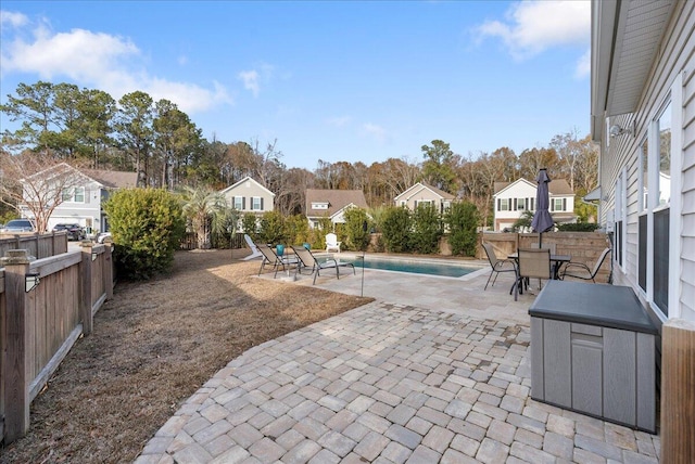 view of patio / terrace featuring a fenced in pool