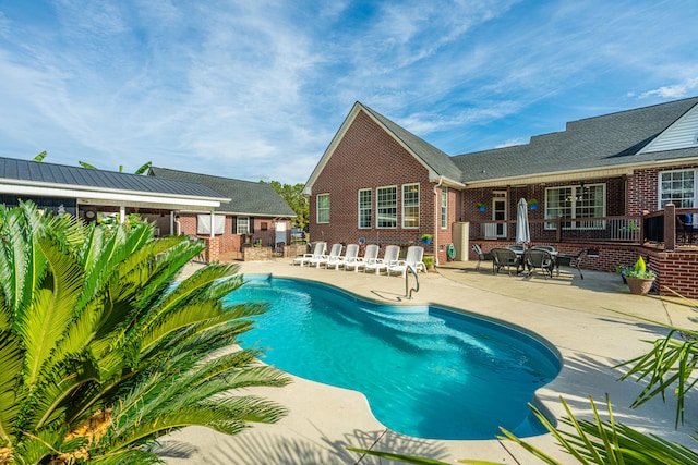 view of swimming pool featuring a patio