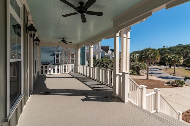 deck with ceiling fan and a porch