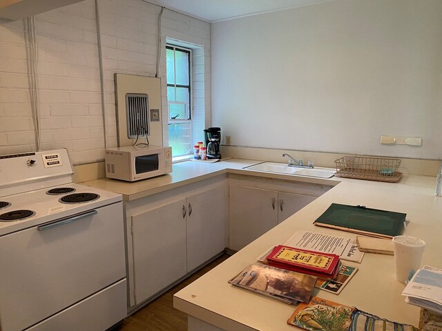 kitchen featuring white appliances and sink