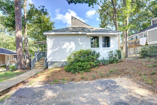 view of property exterior featuring fence