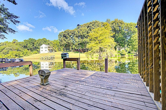 deck with a water view and a dock