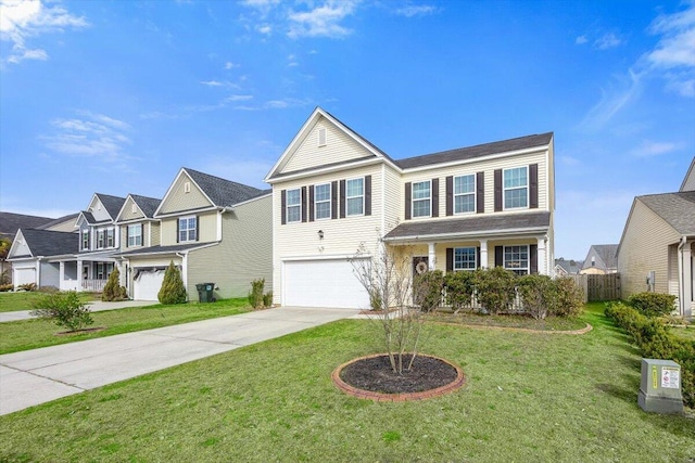 traditional-style home with a front yard, driveway, a residential view, and an attached garage