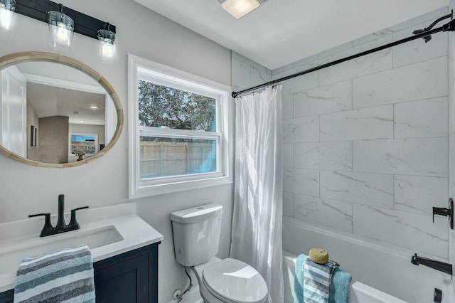 bathroom with shower / bathtub combination with curtain, toilet, and vanity