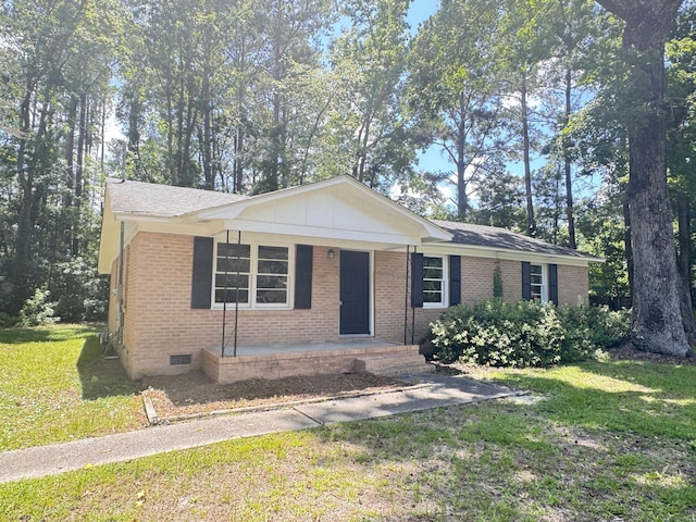 114 Madison St, Walterboro, SC 29488 - ranch-style house with a front lawn, brick siding, crawl space, and covered porch