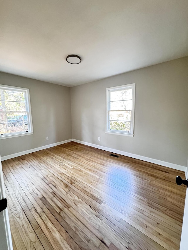 114 Madison St, Walterboro, SC 29488 - unfurnished room with healthy amount of natural light and hardwood / wood-style floors