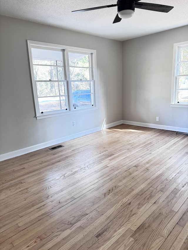 114 Madison St, Walterboro, SC 29488 - unfurnished room with a ceiling fan, hardwood / wood-style flooring, and a textured ceiling