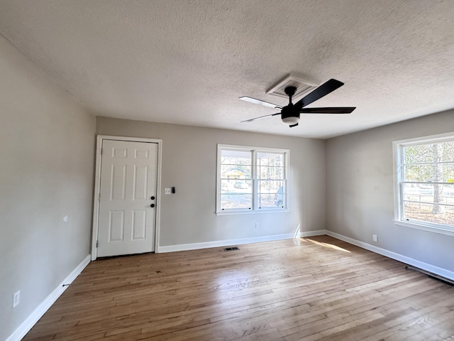 114 Madison St, Walterboro, SC 29488 - spare room with ceiling fan, healthy amount of natural light, wood finished floors, and a textured ceiling