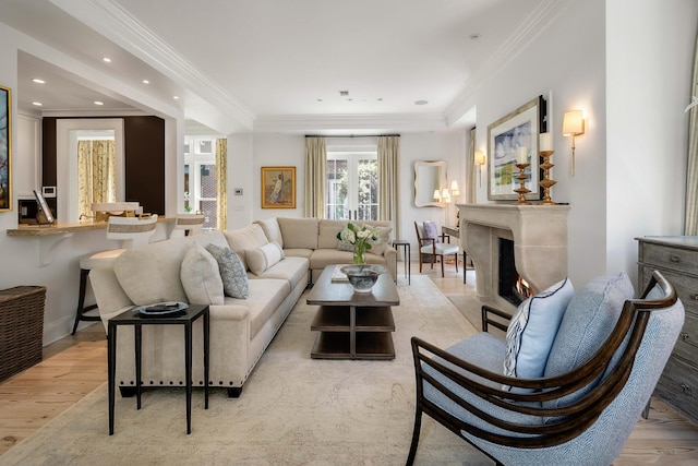 32 Prioleau St Unit J, Charleston, SC 29401 - living area featuring a high end fireplace, light wood-type flooring, crown molding, and recessed lighting