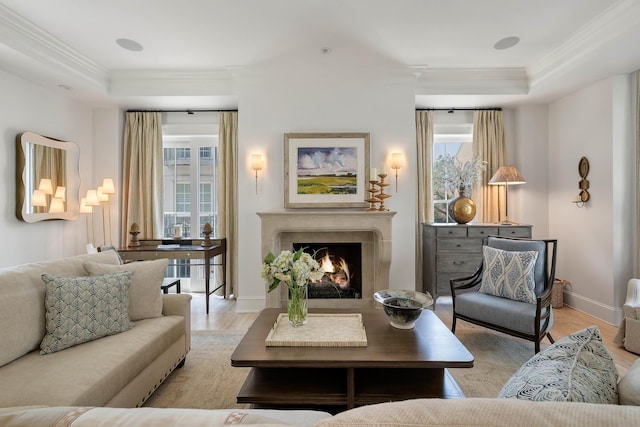 32 Prioleau St Unit J, Charleston, SC 29401 - living area with crown molding, plenty of natural light, light wood-style floors, and a tray ceiling