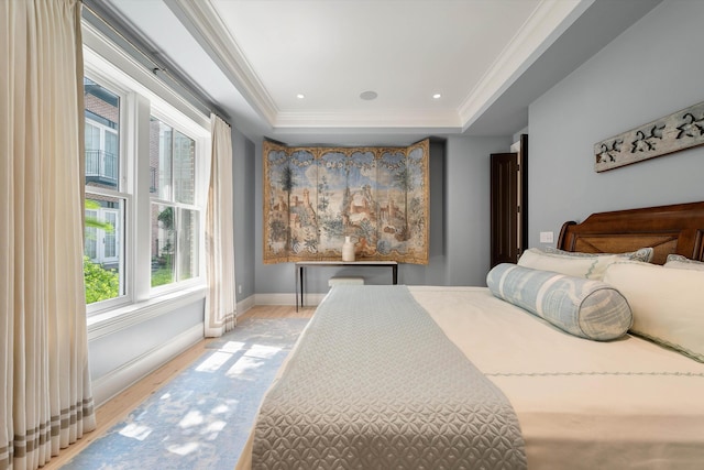32 Prioleau St Unit J, Charleston, SC 29401 - bedroom featuring light wood finished floors, a raised ceiling, crown molding, and recessed lighting