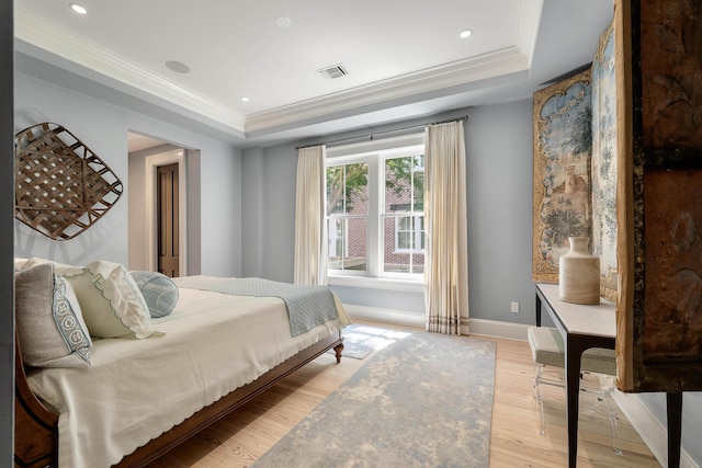 32 Prioleau St Unit J, Charleston, SC 29401 - bedroom with a tray ceiling, crown molding, light wood finished floors, and recessed lighting