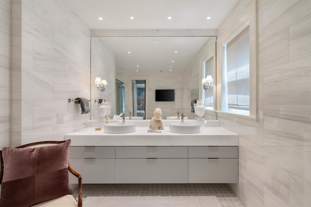 32 Prioleau St Unit J, Charleston, SC 29401 - full bath featuring tile walls, double vanity, and an enclosed shower