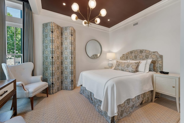 32 Prioleau St Unit J, Charleston, SC 29401 - carpeted bedroom with ornamental molding and a chandelier