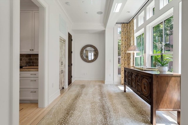 32 Prioleau St Unit J, Charleston, SC 29401 - entrance foyer with ornamental molding and light wood-style floors