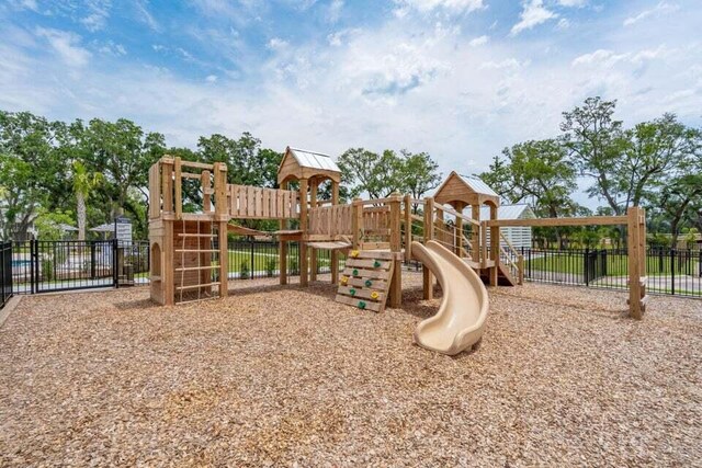 community jungle gym featuring fence