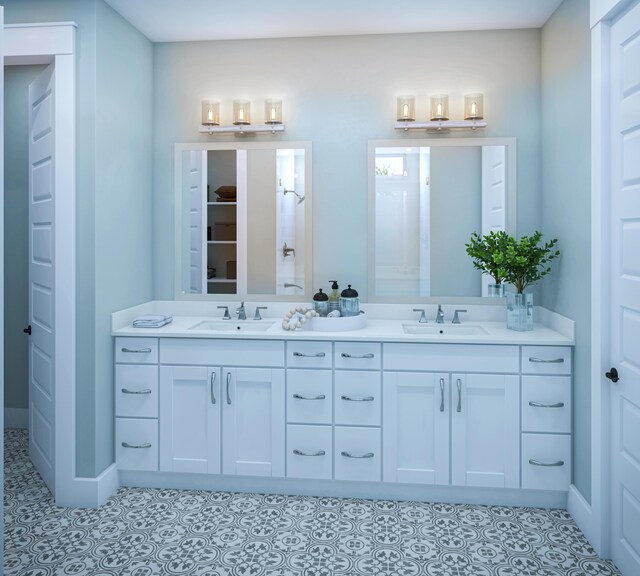 bathroom featuring double vanity, a sink, and tile patterned floors