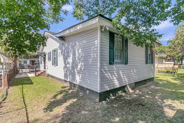 2215 Suffolk St, North Charleston, SC 29405 - view of home's exterior featuring crawl space, a yard, and a wooden deck