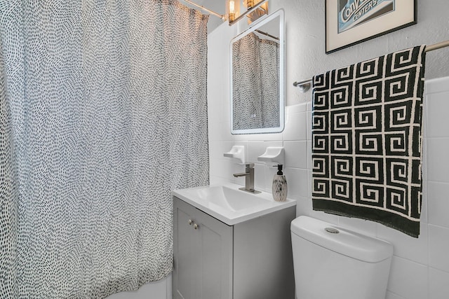 2215 Suffolk St, North Charleston, SC 29405 - full bath featuring tile walls, vanity, and a shower with curtain