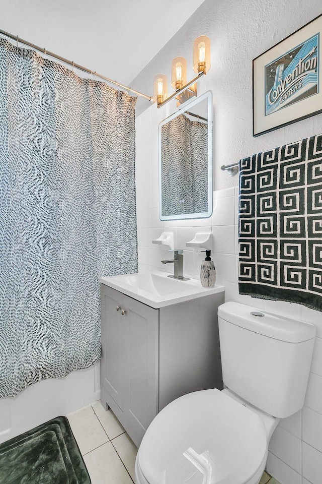 2215 Suffolk St, North Charleston, SC 29405 - full bath featuring vanity, tile walls, and tile patterned floors