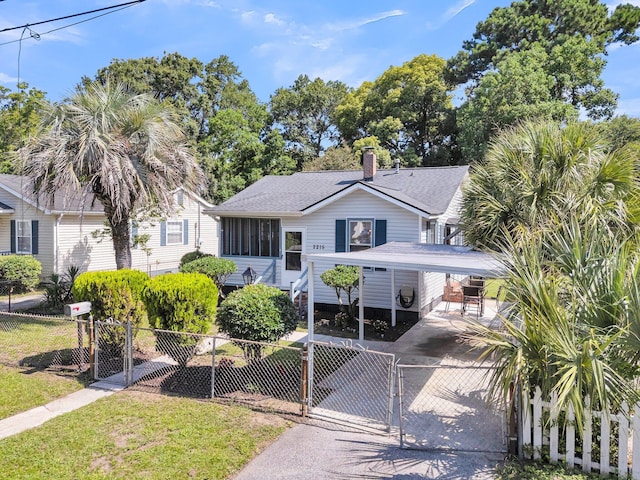 2215 Suffolk St, North Charleston, SC 29405 - view of front of house with a gate, roof with shingles, driveway, and a detached carport