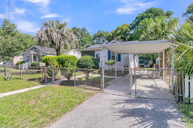 2215 Suffolk St, North Charleston, SC 29405 - view of front of property featuring a gate, a fenced front yard, a chimney, and a detached carport