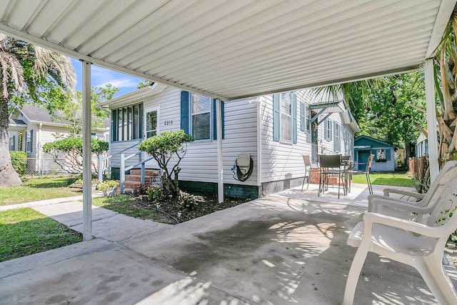 2215 Suffolk St, North Charleston, SC 29405 - view of patio with outdoor dining area and an outdoor structure