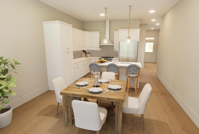 dining area featuring baseboards, recessed lighting, and light wood-style floors