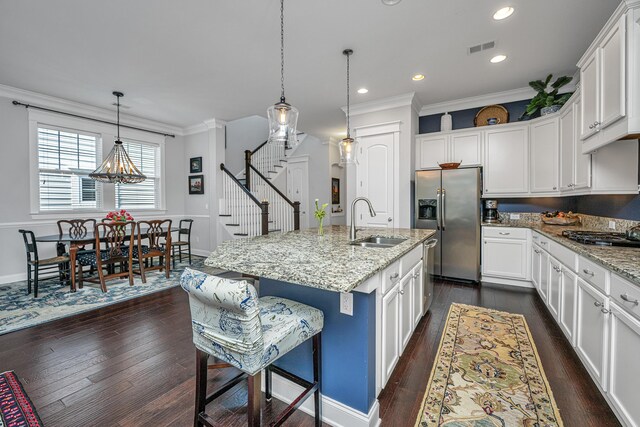 3769 Maidstone Dr, Mount Pleasant, SC 29466 - kitchen featuring a sink, appliances with stainless steel finishes, ornamental molding, baseboards, and white cabinetry