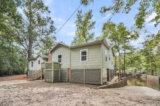 back of property featuring a wooden deck