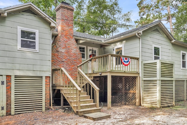 back of property with a wooden deck