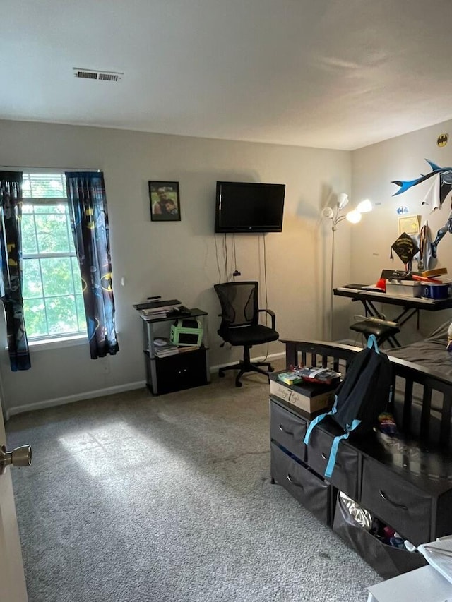 carpeted living area featuring baseboards