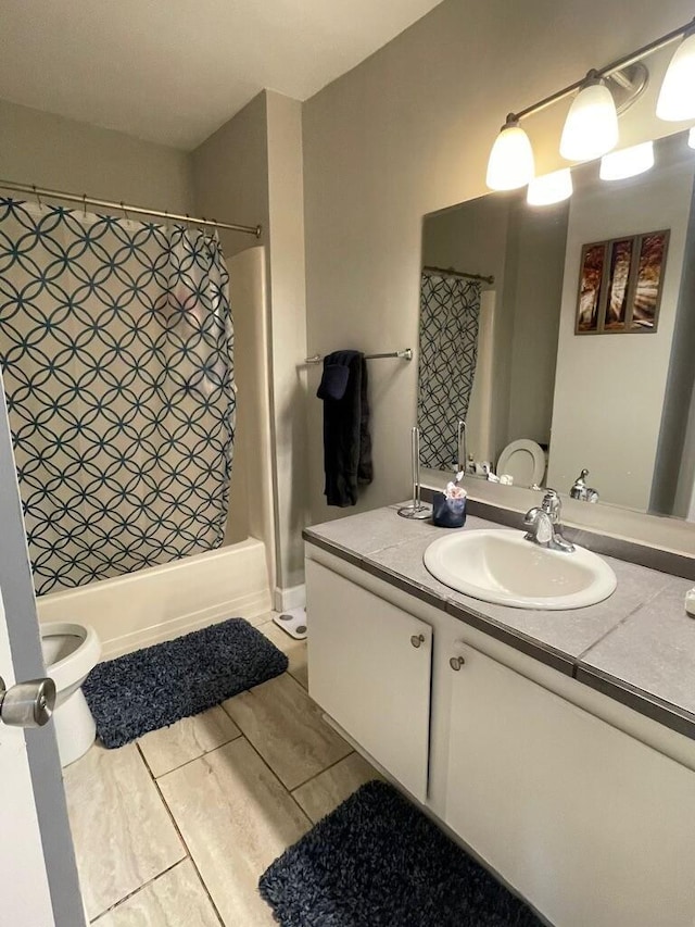 full bathroom featuring vanity and toilet