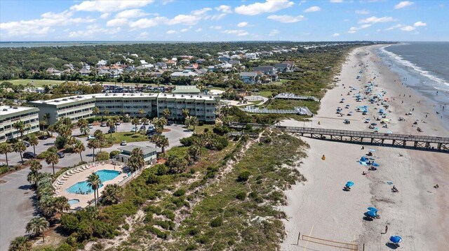 bird's eye view with a water view and a view of the beach