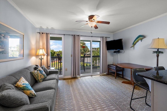 carpeted living room with ceiling fan and ornamental molding