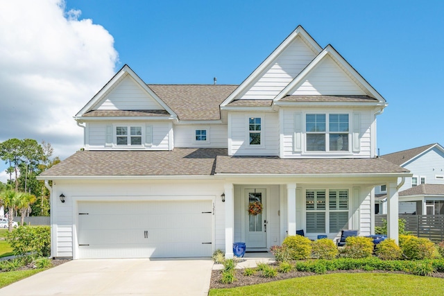 view of front of home with a porch and a garage