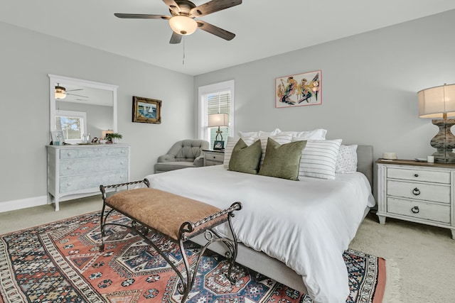 bedroom featuring ceiling fan, carpet, and baseboards