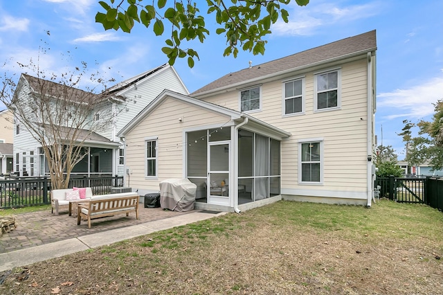 rear view of property with a patio, a fenced backyard, an outdoor living space, a sunroom, and a yard