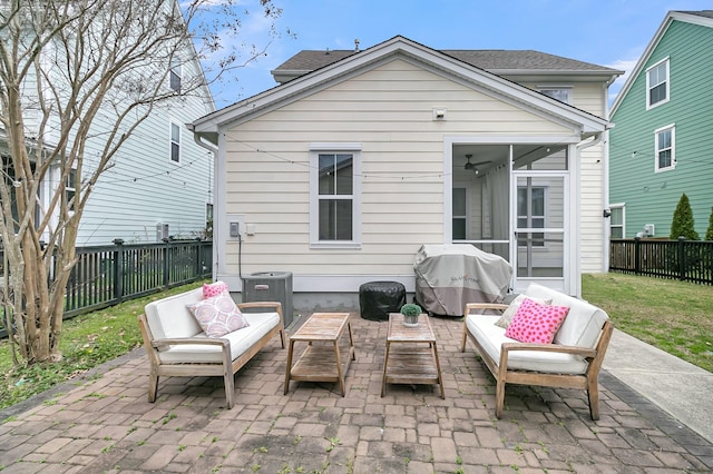 back of property with a patio, a sunroom, a fenced backyard, an outdoor hangout area, and central air condition unit