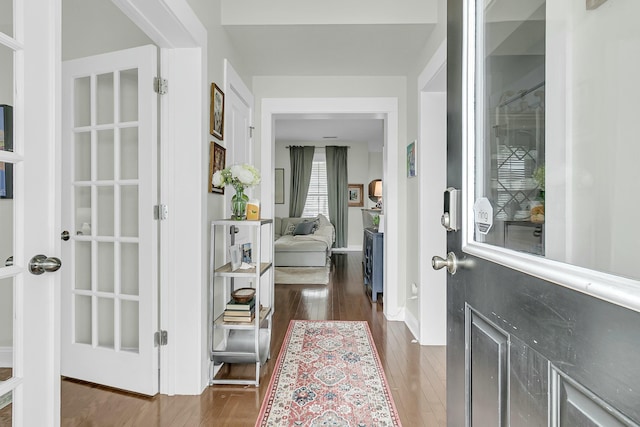 entryway with dark wood-style floors