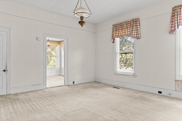 unfurnished room with carpet flooring