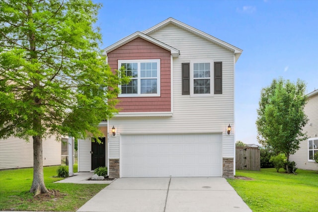9747 Seed St, Ladson, SC 29456 - traditional-style house featuring stone siding, a garage, driveway, and a front yard