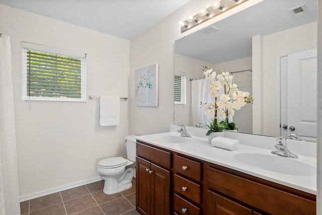 9747 Seed St, Ladson, SC 29456 - full bathroom featuring double vanity, healthy amount of natural light, toilet, and baseboards
