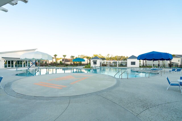 9747 Seed St, Ladson, SC 29456 - community pool featuring a patio