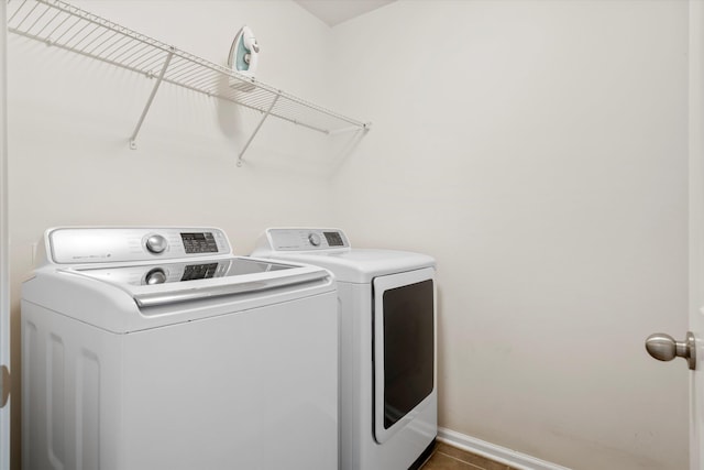 9747 Seed St, Ladson, SC 29456 - laundry area with washing machine and clothes dryer, baseboards, and tile patterned floors