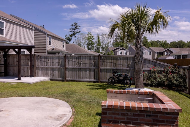 view of yard with a residential view and a patio